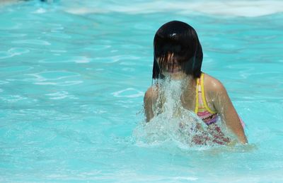 Girl swimming in pool