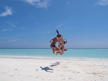 Rear view of man standing on beach