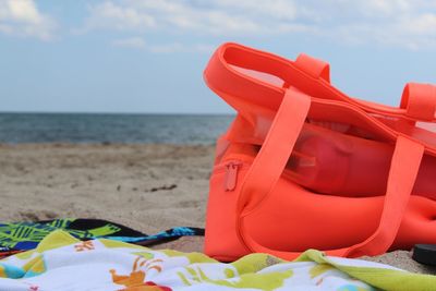 Close-up of lifeguard hut on beach against sky