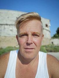 Close-up portrait of mid adult man outdoors