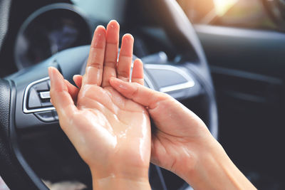 Close-up of hand holding car