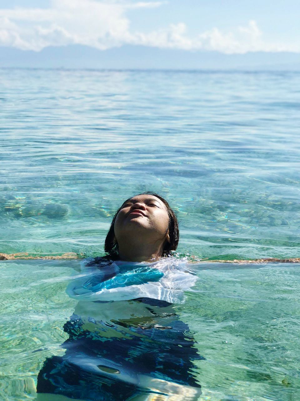 water, day, one person, waterfront, swimming pool, sea, headshot, outdoors, real people, nature, swimming, sky, floating on water, young adult, beauty in nature, underwater, young women, people