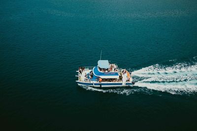 High angle view of people on boat sailing in sea