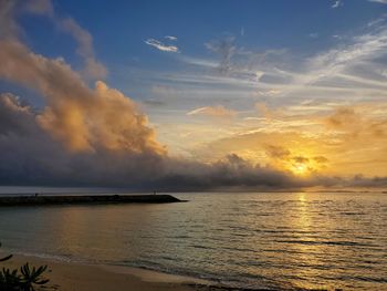 Scenic view of sea against sky during sunset