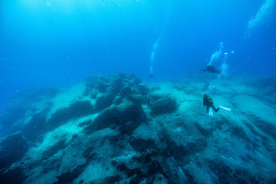 Scuba divers swimming underwater