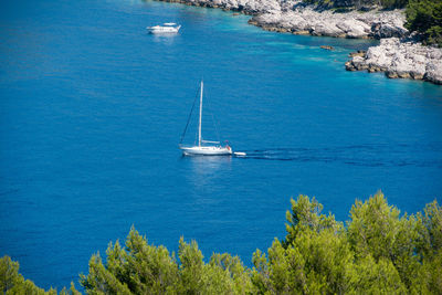 High angle view of sailboat sailing on sea