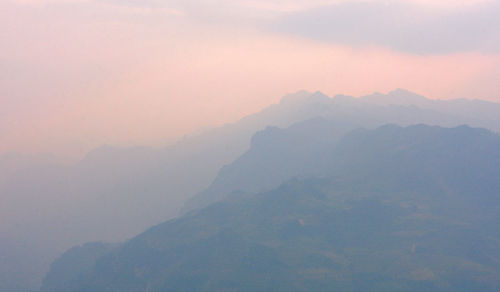 Scenic view of mountains against sky during sunset