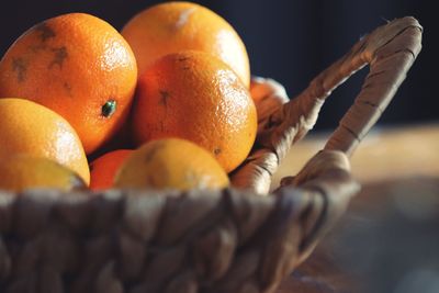 Close-up of hand holding orange