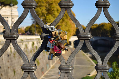 Close-up of padlocks on bridge railing