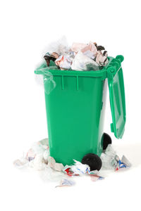 Garbage bin against white background