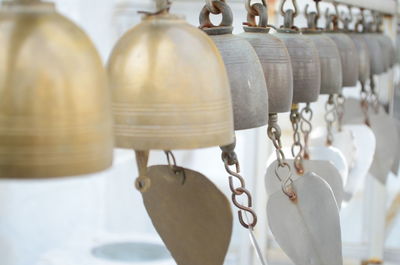 Close-up of bell hanging against wall