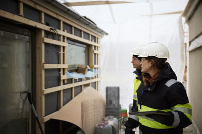 Engineers talking at building site