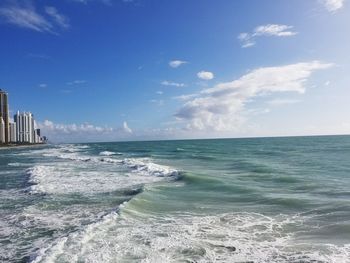 Scenic view of sea against cloudy sky