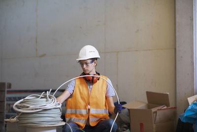 Young woman working in a workshop as artisan manual worker