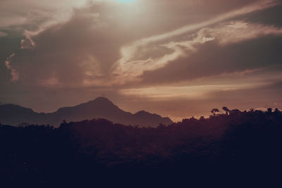 Scenic view of silhouette mountain against sky during sunset