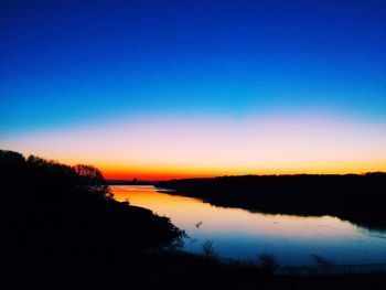 Sunset over calm lake