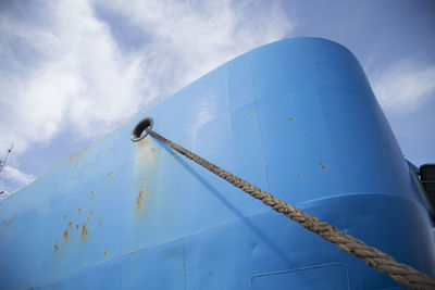 Low angle view of moored boat against sky