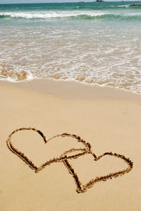 Heart shape on sand at beach