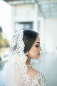 Close-up of woman looking at camera