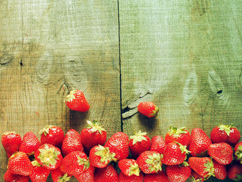 Directly above shot of strawberries on wooden table