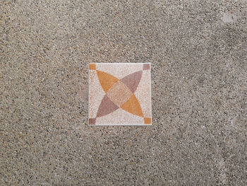 Directly above shot of tile on footpath