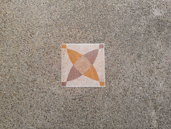 High angle view of arrow sign on road