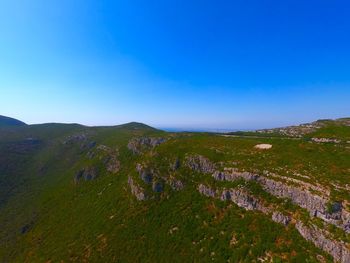 High angle view of landscape against blue sky