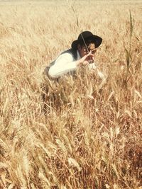 Woman standing on grassy field