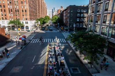 High angle view of people sitting in bus on city street