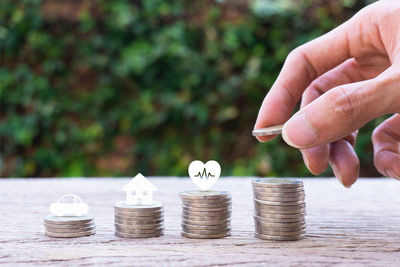 Close-up of hand holding coins