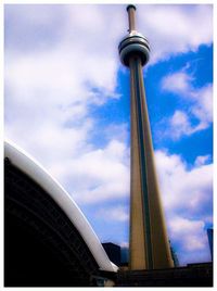 Low angle view of tower against cloudy sky