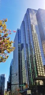 Low angle view of modern buildings against clear sky