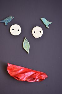 High angle view of paper face on table