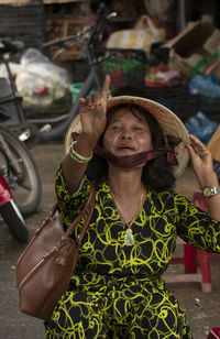 Portrait of a vietnamese woman standing outdoors