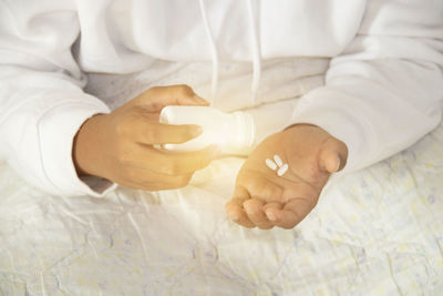 Close-up of child holding hands