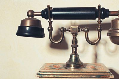 Close-up of rotary phone on table