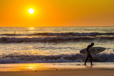 Scenic view of sea at sunset