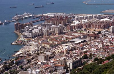 High angle view of buildings by sea