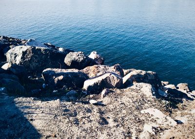 High angle view of rocks in sea