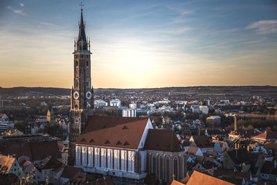 Cityscape against sky during sunset