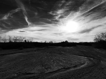 Scenic view of sand against sky