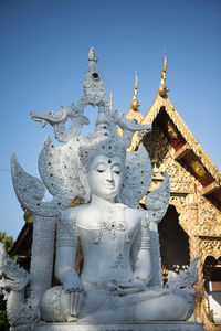 Low angle view of statues at temple