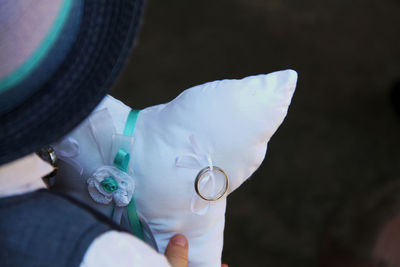 Close-up of cropped hand holding cigarette