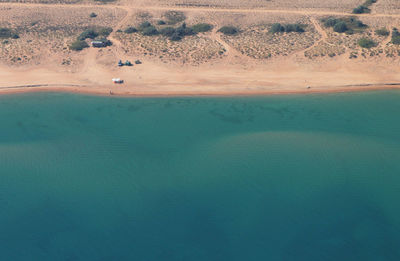 Aerial view of sea by desert