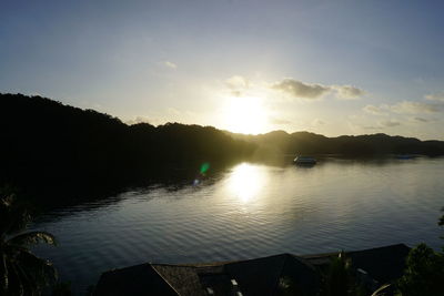 Scenic view of lake against sky during sunset