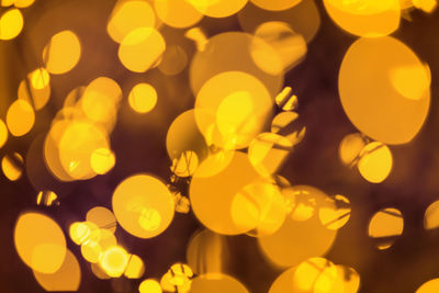 Lights shine in the warm, festive bokeh. concept festive lighting as a background