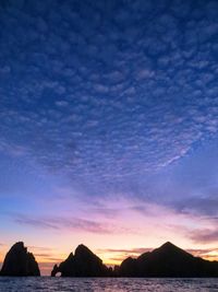 Scenic view of sea against sky at sunset