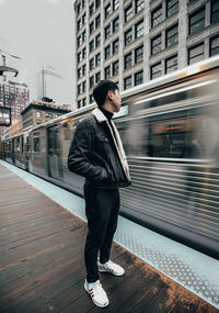 Full length of man standing on train