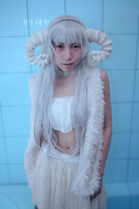 Portrait of young woman in bathtub