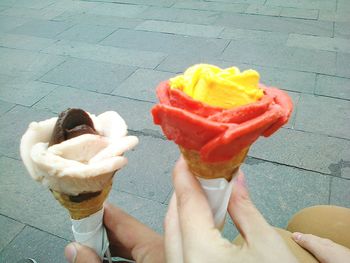 Cropped hand holding ice cream cone